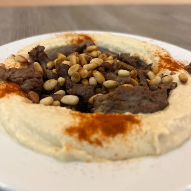 Hummus With Meat And Pine Nuts.
